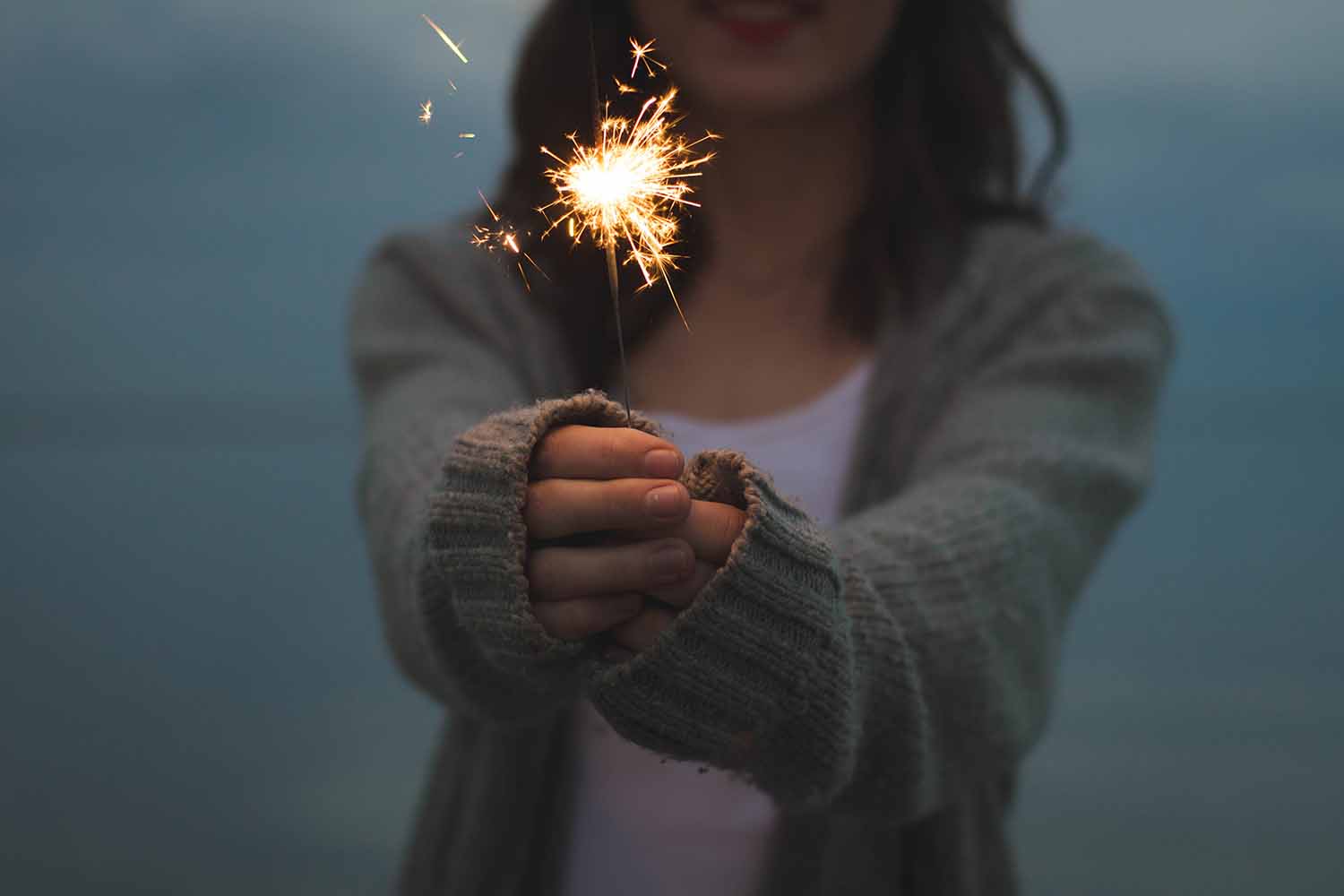 Woman holding sparkler 